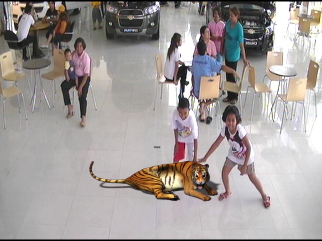 A 3D Tiger appears and sits down in front of the audience.